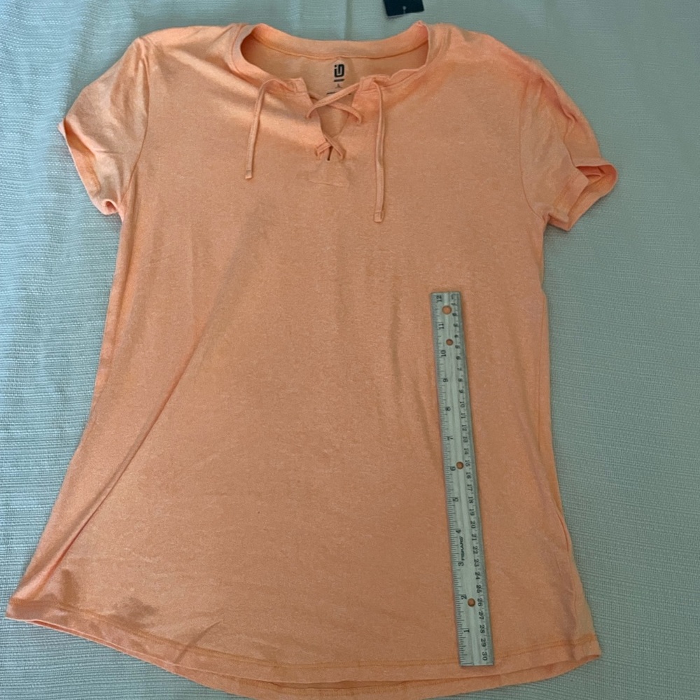 Kids size L sports shirt by ideology! The color is orange!